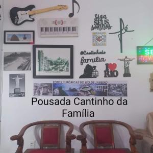 a wall in a room with some stickers on it at Pousada Cantinho da Família in Rio de Janeiro