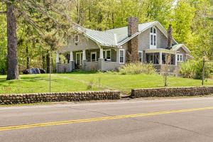 a house sitting on the side of a road at Forestport Home with Access to Otter Lake in Forestport