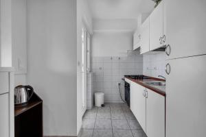 Kuchyňa alebo kuchynka v ubytovaní Urban Apartment