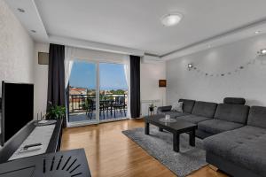 Televízia a/alebo spoločenská miestnosť v ubytovaní Urban Apartment