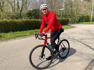 a man riding a bike down a road at Zwols Groen in Zwolle