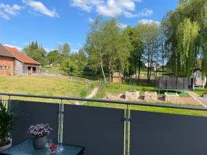 a view of a garden from a balcony at Ferienwohnung in Hünfeld