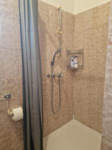 a shower with a glass door in a bathroom at Apartments "Villa Cupic"-Vodice in Vodice +12 photos