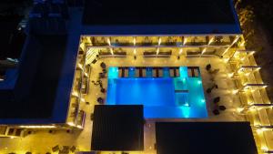 an overhead view of a building at night with lights at Avaton Luxury Resort and Spa Access the Enigma - Adults Only & Kids 14 Plus- in Asprovalta