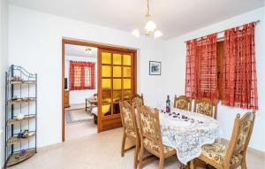 a dining room with a table and chairs at Lovely Apartment In Slano With Wifi in Slano