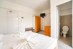 Postel nebo postele na pokoji v ubytování Sotirakis Hotel