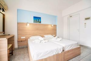 Postel nebo postele na pokoji v ubytování Sotirakis Hotel