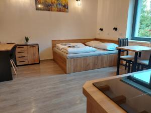 Posteľ alebo postele v izbe v ubytovaní Apartmány Lucie