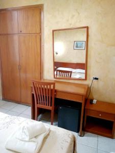 Postel nebo postele na pokoji v ubytování Hotel Ferrari