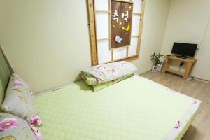 Postel nebo postele na pokoji v ubytování Danaharu Guesthouse