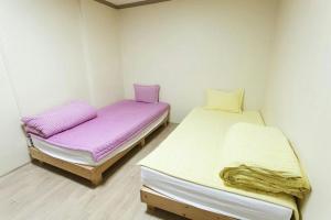 Postel nebo postele na pokoji v ubytování Danaharu Guesthouse
