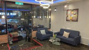 Posezení v ubytování Hotel Dlima Inn Bukit