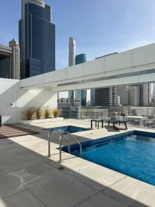 a swimming pool on the roof of a building at Home 4U in Dubai Center in Dubai