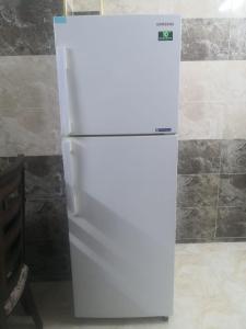Kuchyň nebo kuchyňský kout v ubytování White tulips apartment الزنبقة البيضاء