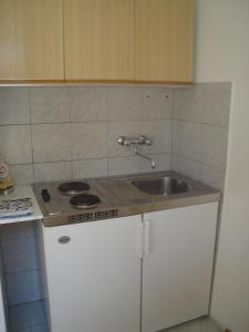 Kuchyň nebo kuchyňský kout v ubytování Apartments Kurilić