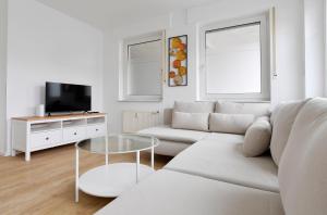 TV a/nebo společenská místnost v ubytování Stay and Work Apartment - 8 beds - 4 bed rooms