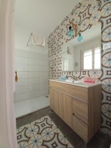 a bathroom with a sink and a mirror at Bon Repòs in Cambrils +52 photos