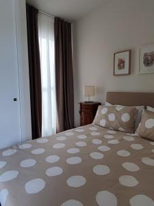 a bedroom with a large bed and a window at Alimede in Santa Croce Camerina