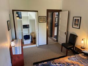 a bedroom with a bed and a desk and a chair at Come and Get your Love at Hikers Haven! Only 10 minutes from Mount Shasta-Pet Friendly in Mount Shasta