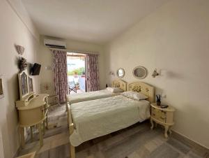 Postel nebo postele na pokoji v ubytování Naxos Philoxenia