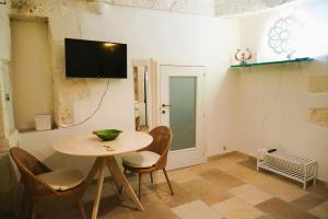TV a/nebo společenská místnost v ubytování Casetta a due passi - dal CENTRO STORICO