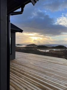 a deck with a view of the ocean from a house at Sea & Sky Vestfjord Panorama in Lødingen