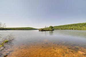 a large body of water with trees in the background at 1 Mi to Big Boulder Lakefront Unit with Pool Access in Lake Harmony