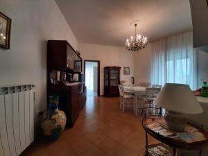 a living room with a table and a dining room at Casa Ricordi in Vietri sul Mare