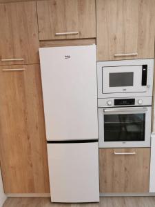 Kuchyň nebo kuchyňský kout v ubytování Playa Home Noja + 9 fotografií
