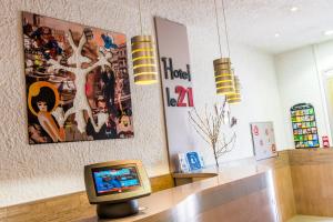 TV a/nebo společenská místnost v ubytování Hotel Le 21