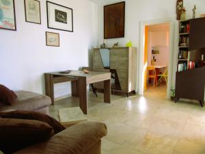 a living room with a table and a couch at Casa Milena in Vallecchia