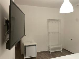 a bathroom with a glass refrigerator and a table at A casa di NENÉ BeB in Lesina