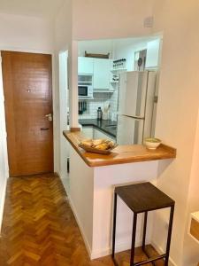 a kitchen with a counter and a refrigerator at flat in Buenos Aires in Buenos Aires
