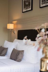Postel nebo postele na pokoji v ubytování Hotel-Restaurant Jagdhaus Heede