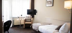 Postel nebo postele na pokoji v ubytování Hotel-Restaurant Jagdhaus Heede