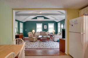 a kitchen and living room with a white refrigerator at Charming Marthas Vineyard Home Near Beach and Town! in Edgartown