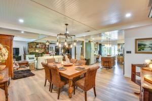 a dining room and living room with a table and chairs at Whimsical Athens Home - 3 Mi to Sanford Stadium in Athens