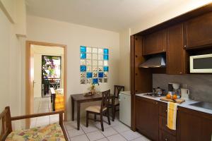 A kitchen or kitchenette at Trefon Hotel Apartments and Family Suites