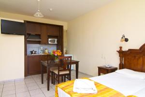 A kitchen or kitchenette at Trefon Hotel Apartments and Family Suites