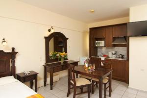 A kitchen or kitchenette at Trefon Hotel Apartments and Family Suites