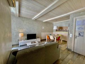 a living room with a couch and a table at Barcelonaforrent Market Suites in Barcelona