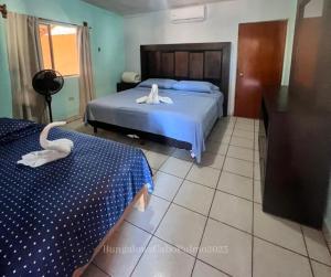 Postel nebo postele na pokoji v ubytování Bungalows Cabo Pulmo