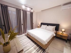A bed or beds in a room at Kartal Konağı