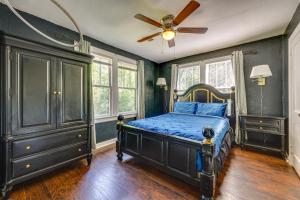 a bedroom with a bed and a ceiling fan at Jacksonville Vacation Rental with Deck! in Jacksonville