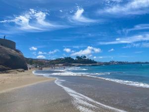 a beach with the ocean and a blue sky at BuenaVista Palmeras in Costa Adeje in Adeje