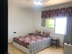 Una cama o camas en una habitación de Grand appart avec vue sur mer