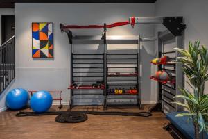 a room with a gym with a bunk bed at Radisson Hotel & Suites Zurich in Opfikon