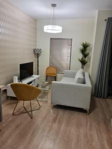 A seating area at Modern One Bedroom Apartment in Rivonia