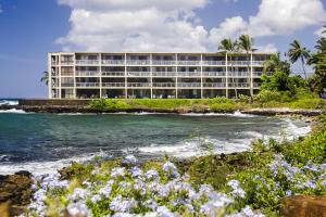 a hotel on the shore of the ocean at Kuhio Shores 207 in Koloa