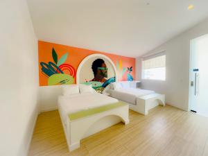 Giường trong phòng chung tại Hotel Nomadic Design